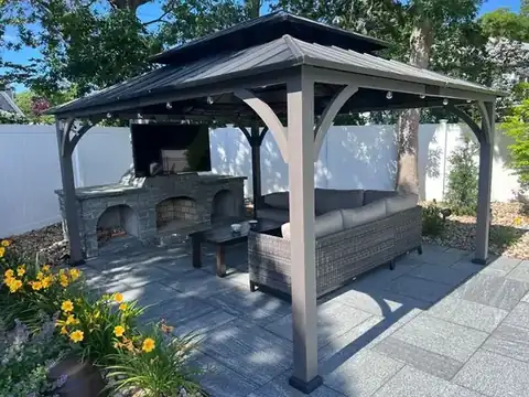 Gazebo with outdoor kitchen on a bluestone patio