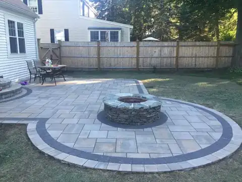 Fire pit patio with bordered paver ring