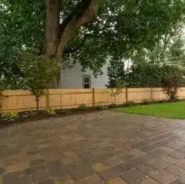Paver patio and wood fence after the renovation
