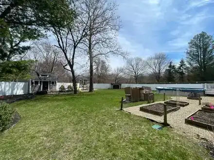 Backyard with raised garden beds before the renovation